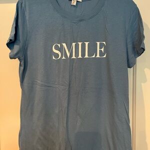 EUC. Sub-urban riot SMILE tshirt in light blue. Size L